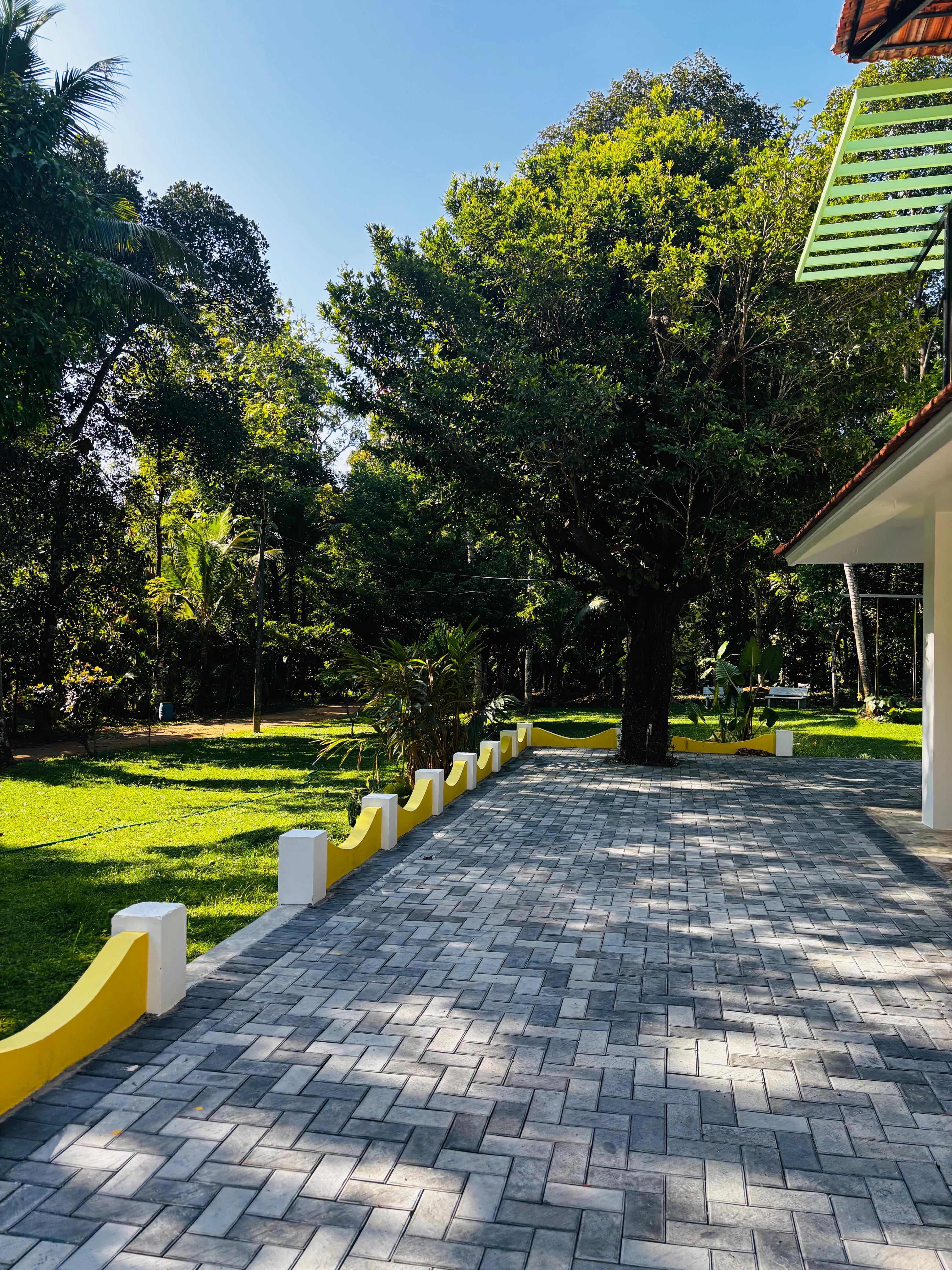 Private villa exterior with lawn and pool